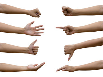 Low angle view of people hands over white background