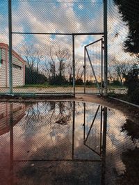 View of soccer field against cloudy sky