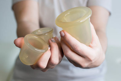 Midsection of woman holding ice cream