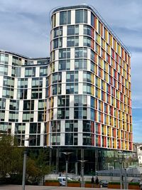 Low angle view of modern building against sky in city