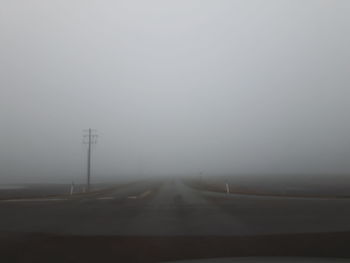 Road against sky during foggy weather