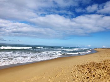 Scenic view of beach against sky