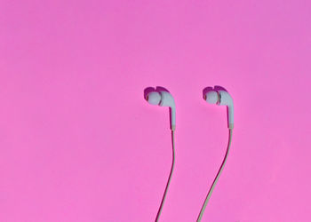 Close-up of pink light painting on wall