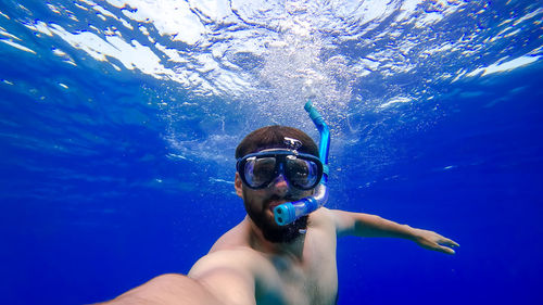 Man swimming in sea