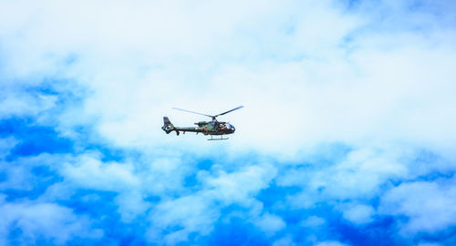 Low angle view of airplane flying in sky