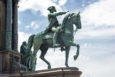 Low angle view of statue against sky