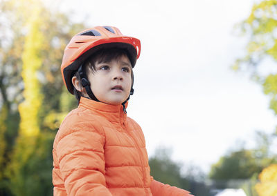 Portrait of boy looking away outdoors