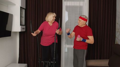 Couple exercising at home