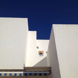 Low angle view of buildings against clear sky