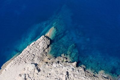 Scenic view of sea against blue sky