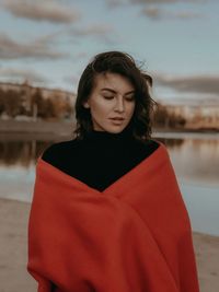 Portrait of a beautiful young woman standing outdoors