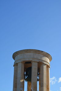 Low angle view of historical building against clear blue sky