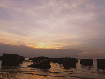 Scenic view of sea against sky at sunset