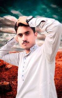 Portrait of young man standing outdoors