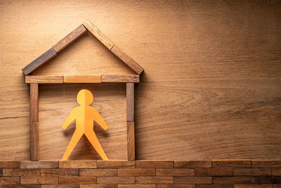 Close-up of yellow toy on wood