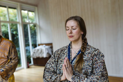 View of woman meditating