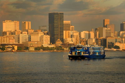 Buildings in city at sunset