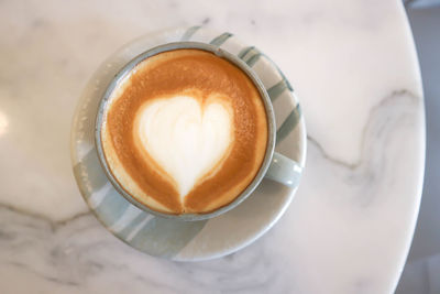 High angle view of cappuccino on table