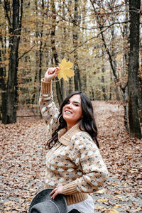 Portrait of a beautiful young woman, autumn, forest, outdoors.