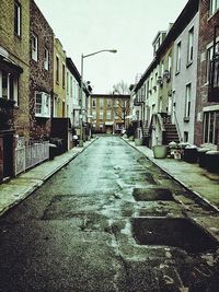 Alley amidst buildings in city