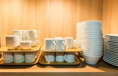 Close-up of coffee cups on table