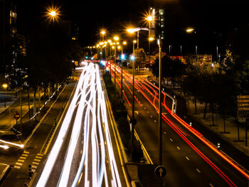 High angle view of light trails on road at night