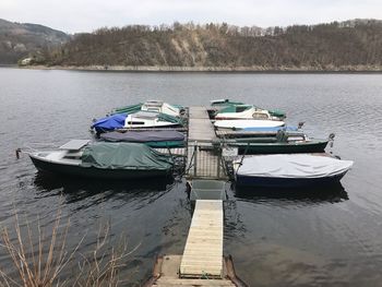 Boats moored on lake