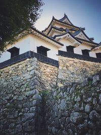 Low angle view of old building against sky