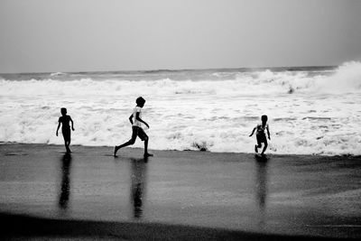 Boys on shore at beach