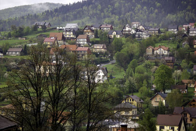 Scenic view of several small houses in small country side town named limanowa located in europe