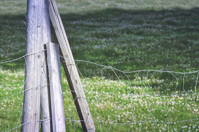 Wooden fence on field