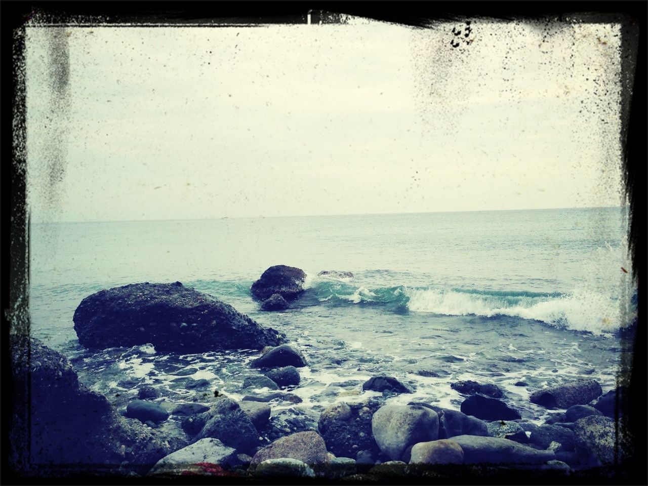 transfer print, sea, water, auto post production filter, horizon over water, rock - object, scenics, beauty in nature, tranquil scene, tranquility, nature, rock, shore, beach, rock formation, wave, sky, idyllic, outdoors, surf