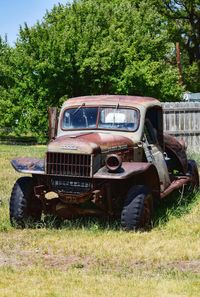 Abandoned car on field