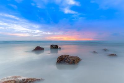 Scenic view of sea against sky during sunset