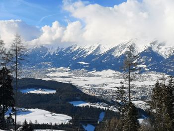 Scenic view of snowcapped mountains against sky