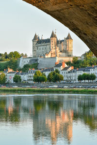 Views of the city of saumur from the riverbank at dusk. loire valley, france.