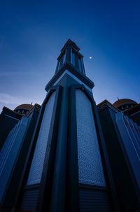 Low angle view of building against blue sky