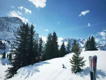 Snow covered landscape against sky