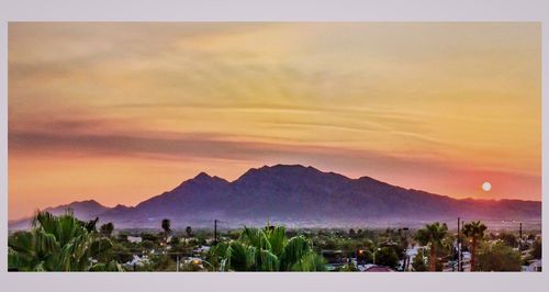 Scenic view of mountains at sunset