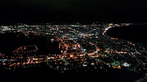 Aerial view of illuminated cityscape at night