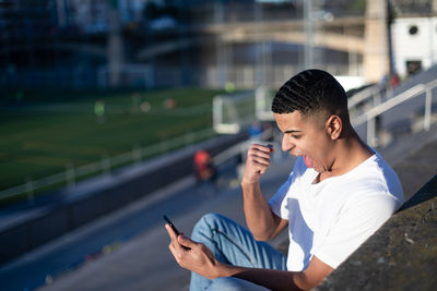 Young man using mobile phone