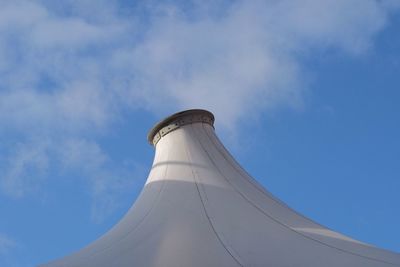 Low angle view of tower against blue sky