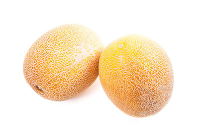 Close-up of oranges against white background