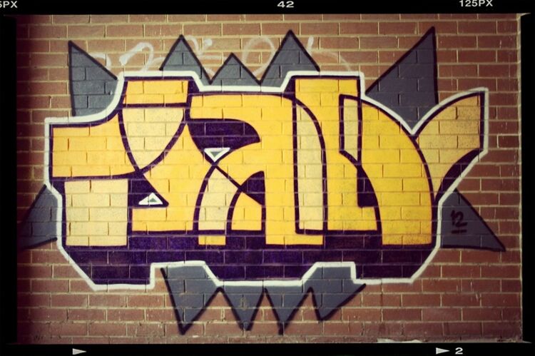 yellow, transfer print, built structure, architecture, multi colored, building exterior, art, creativity, art and craft, wall - building feature, auto post production filter, pattern, graffiti, wall, no people, design, brick wall, day, outdoors, text