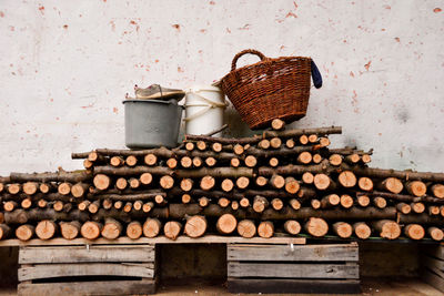 Stack of firewood on wooden wall