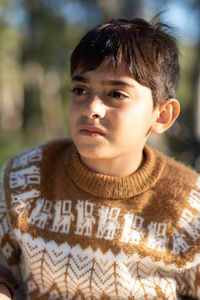 Portrait of boy wearing woolen sweater