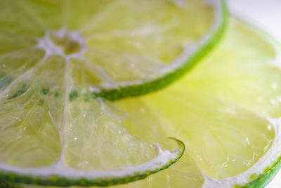 Cropped image of fresh juicy lemon slices on white background