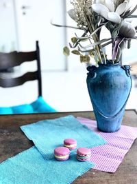 Close-up of blue flower vase on table