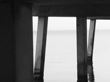 Scenic view of sea against sky seen through pier