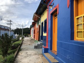 Street amidst buildings against sky